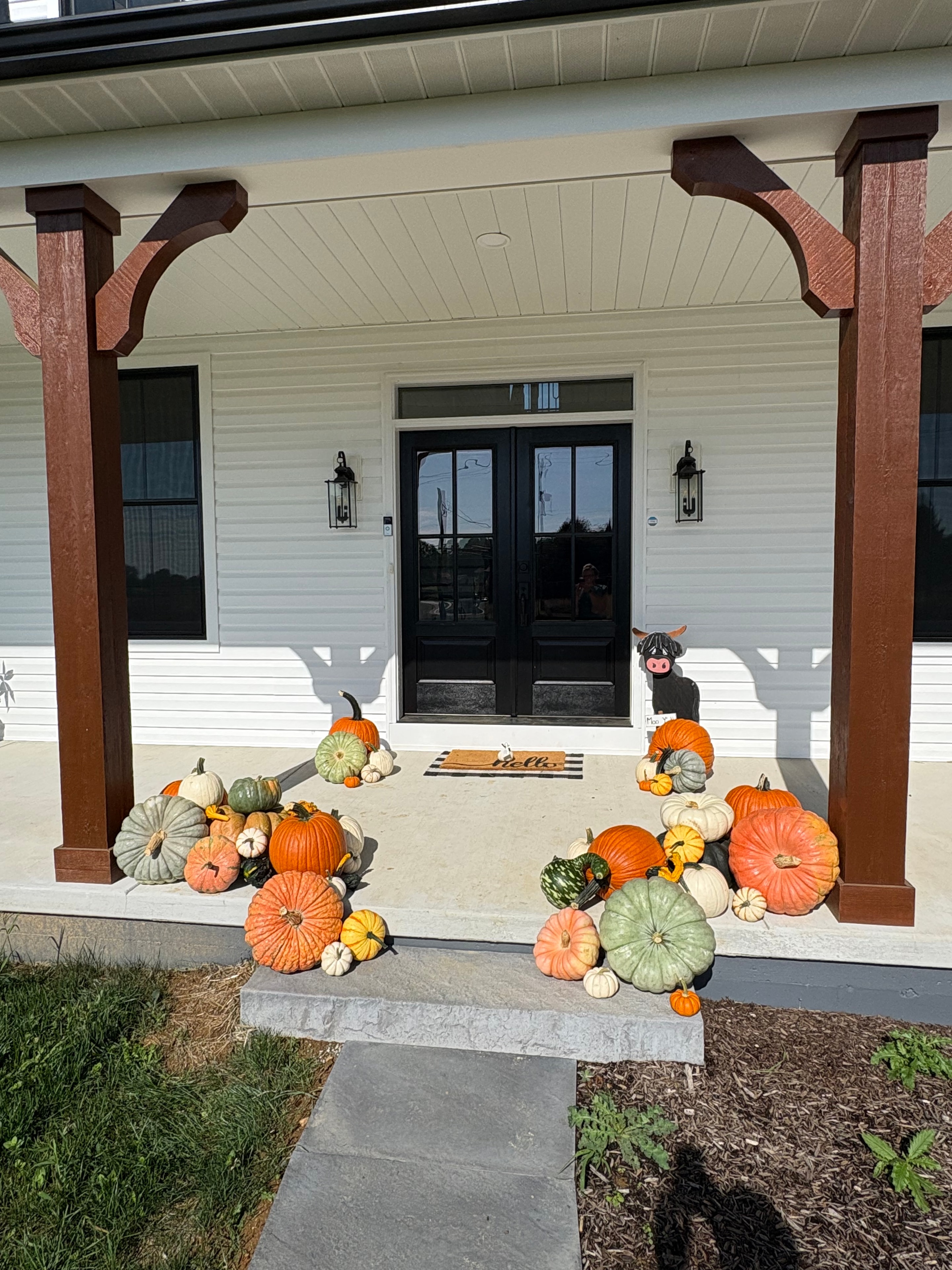 Fall porch styling by Autumn Porch Designs